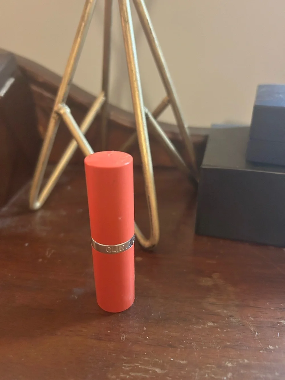Clinique Satin Lipstick in Coral-Orange Shade. Runaway Coral.